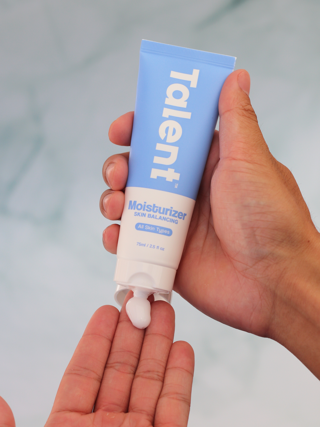 skin balancing moisturizer with cream on hand